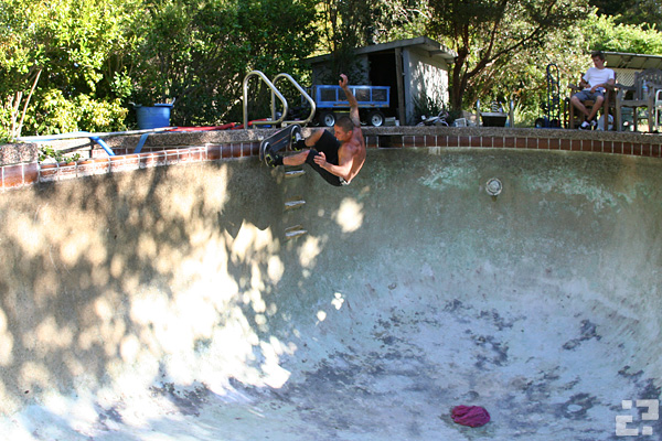 Dan Robinson over the ladder of the newly drained pool. Photo: Aaron Robinson