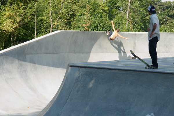 Jake Collins (Wales) scratching a frontside grind on the big oververt wall.
