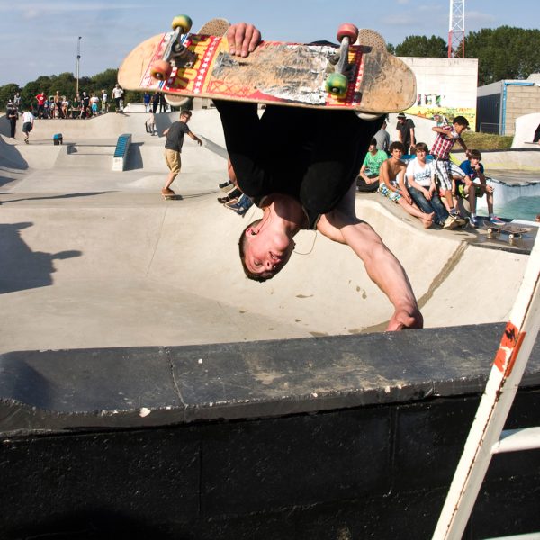 Unknown. Invert on the pool coping of the quarter pipe.