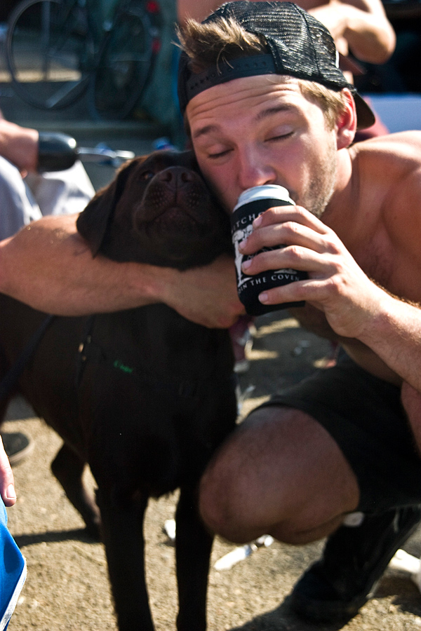 Ratman sharing his love for beer with a dog who might become the first alcoholic dog 
