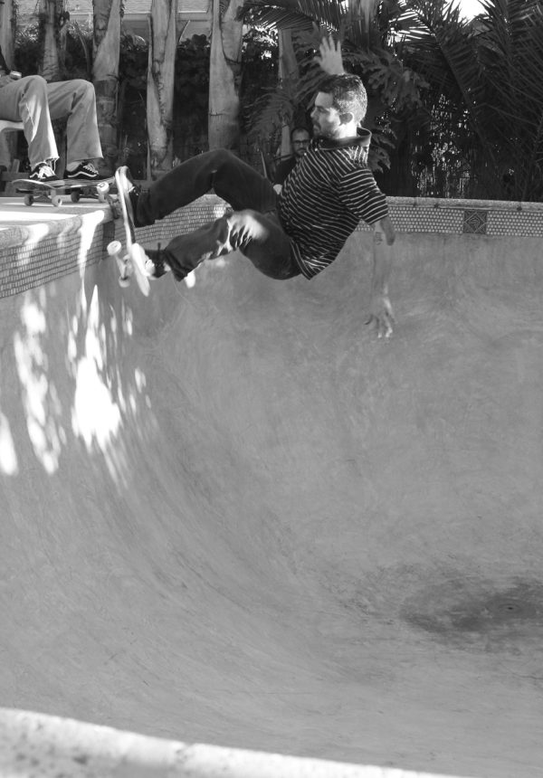 Brandon Klein is a rad photographer and a gnar skateboarder. He would probably have put his nose in focus. Fs grind over the box in barefoot Mike's pool.