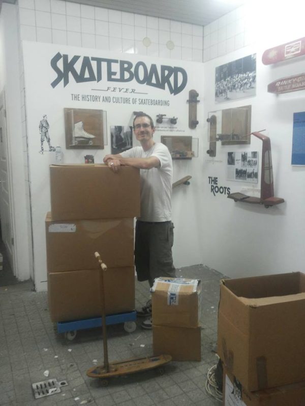 Jürgen Blümlein setting up the Skateboard Fever exhibit.