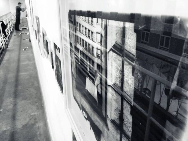 Sergej Vutuc's photos going up on the wall.