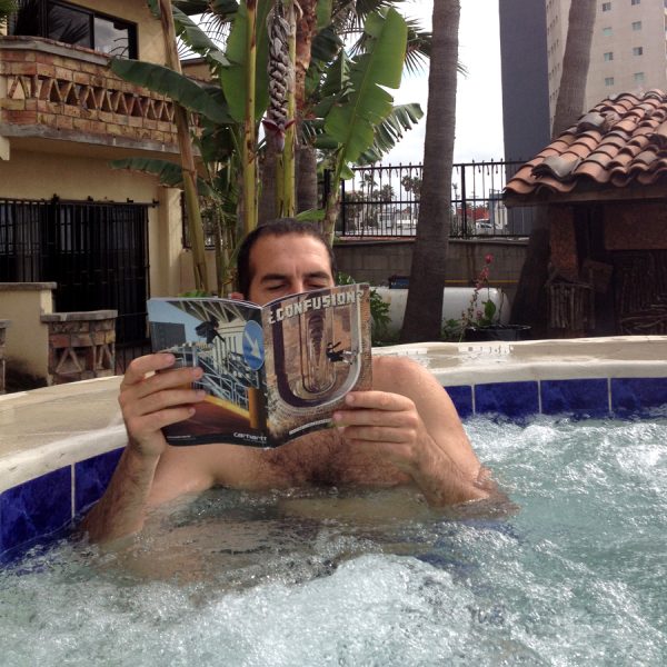 Bailey catching up on Confusion back issues while soaking in the tub. 