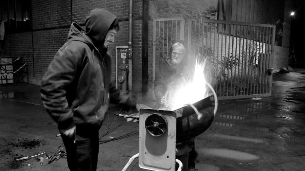 Jens and Jupi stoking the fire, firing up the stoke.