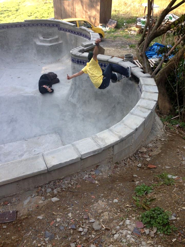 Honda. FS grind in their recently finished backyard pool they built. 