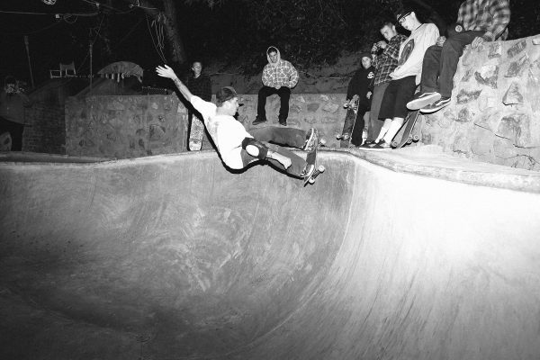 Dave Friel. Frontside grind in the corner. 