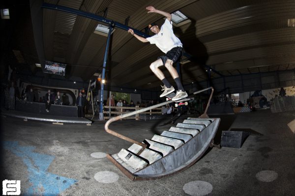 Unknown kid on the handrail.