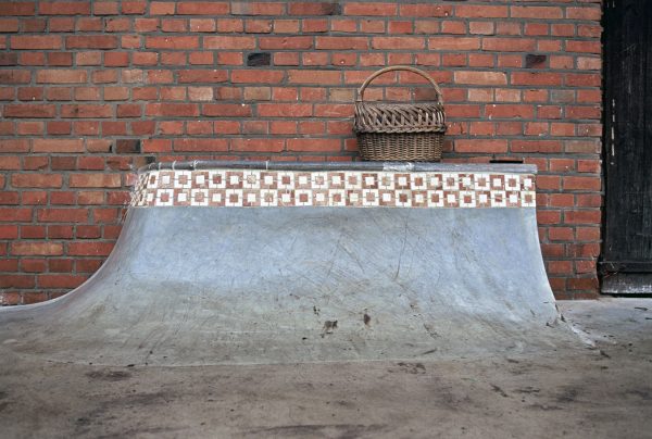 How wouldn't want a quarter pipe with a hip and pool coping built up against their house? Matt wanted one, so he built it.