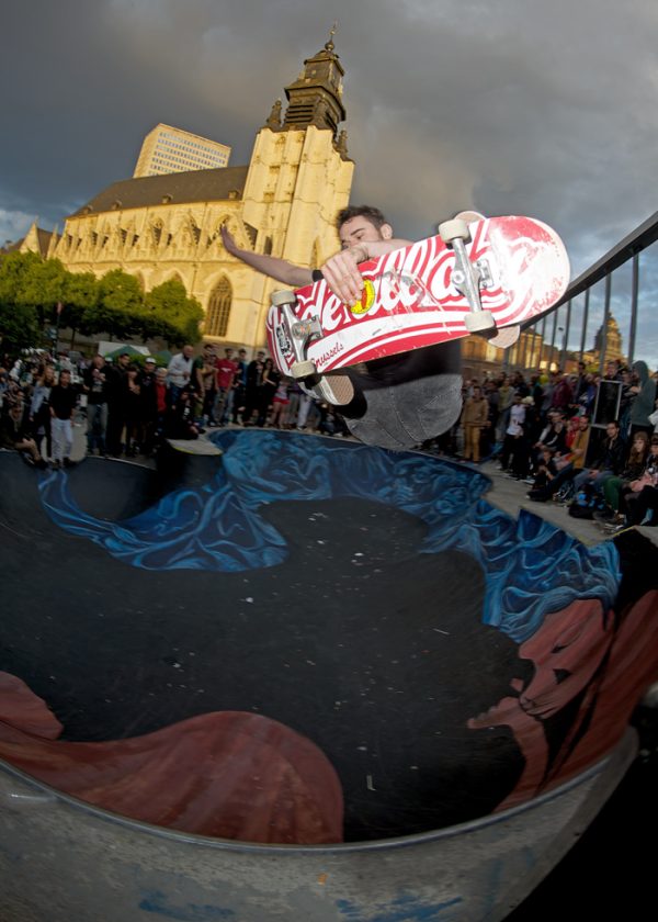 Big frontside air beneath an ominous sky in the shadows of the church. Name unknown.
