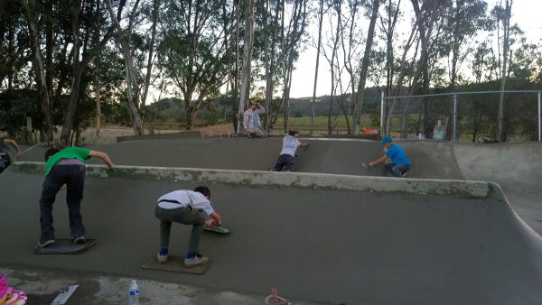 Kids learning how to work for their skate spot.
