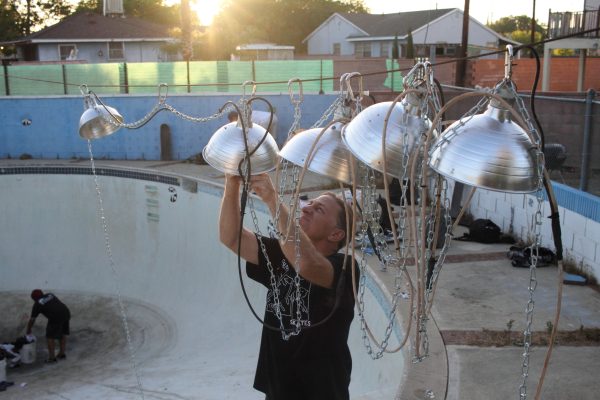 Kenny KING replacing a bulb on the retractable lighting system he engineered.