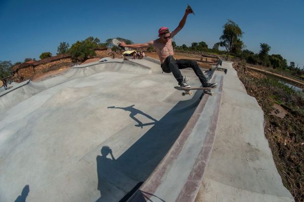 Baumi. Frontside grinding his own creation with trowel in hand.